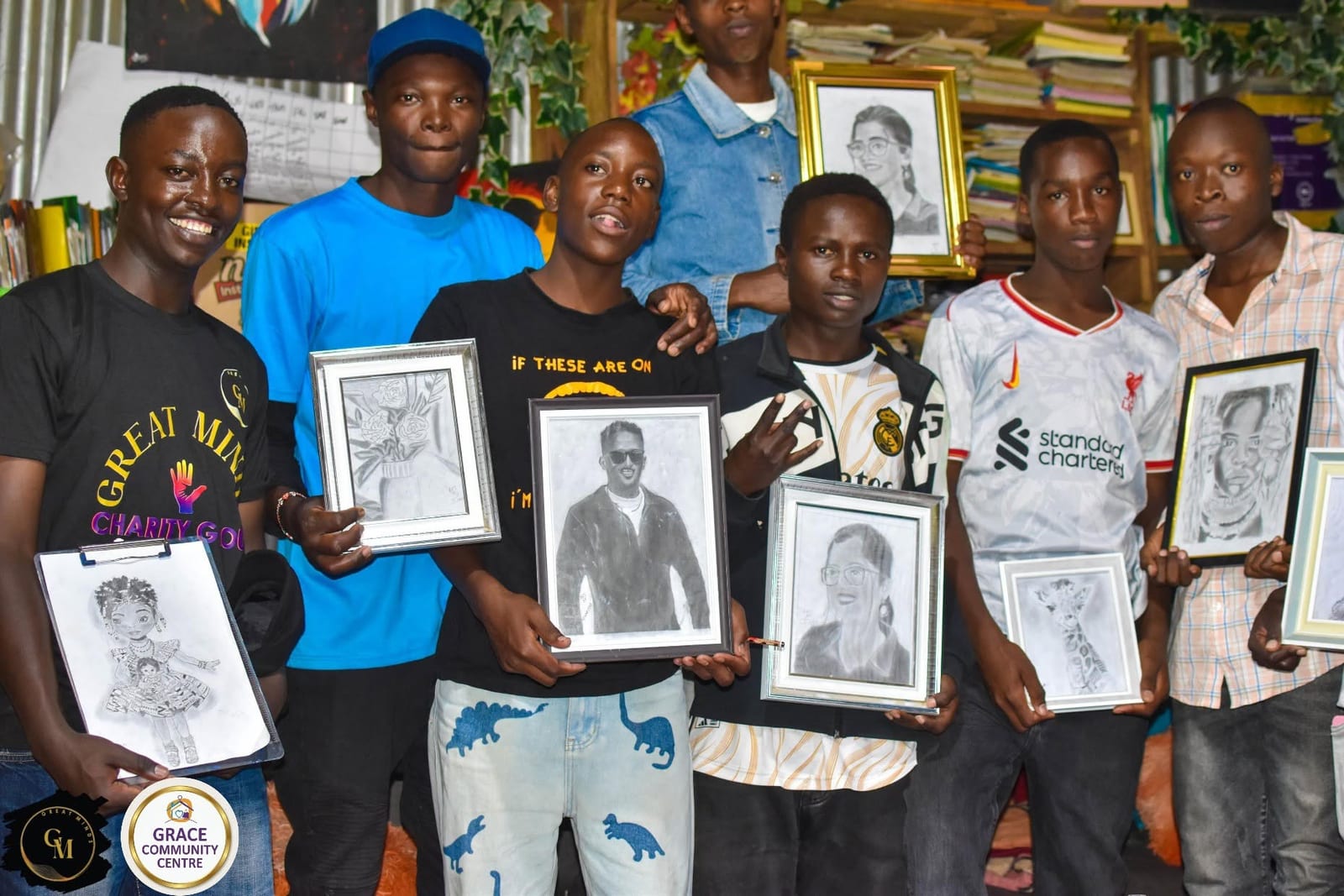 Young people proudly holding their hand-drawn pencil portraits