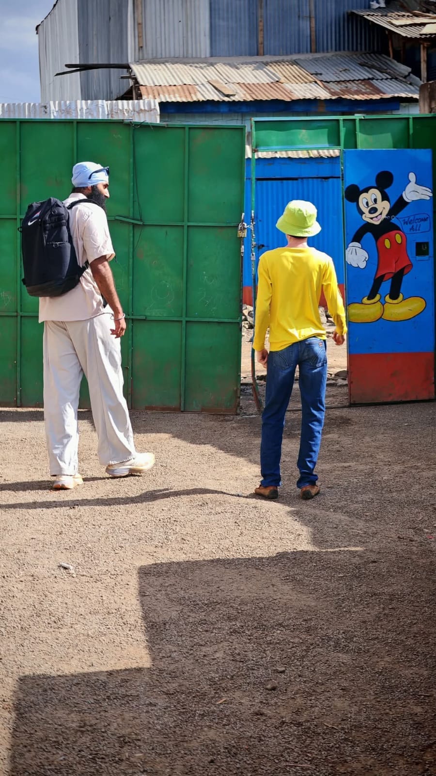Visitors arriving through the centre's brightly painted gate