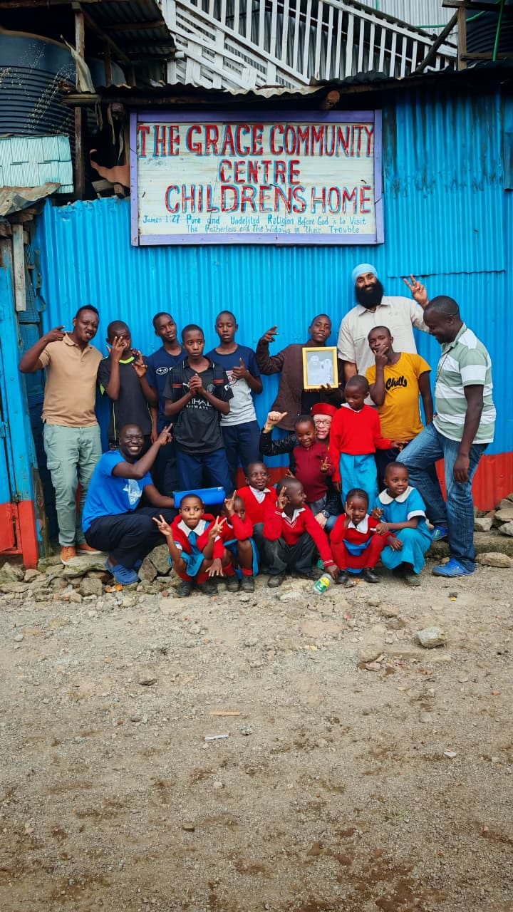 The community gathered beneath the centre's sign