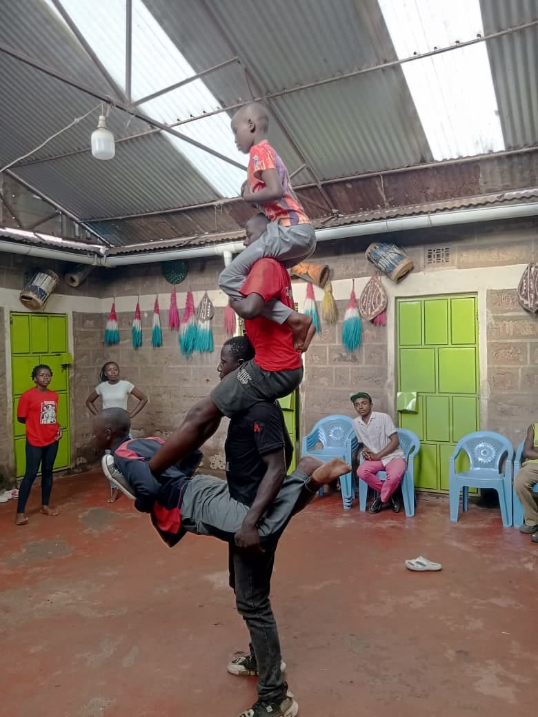 Young performers rehearsing an acrobatic routine