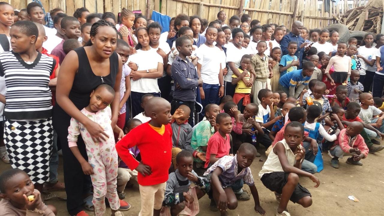 Children and community members together at a gathering