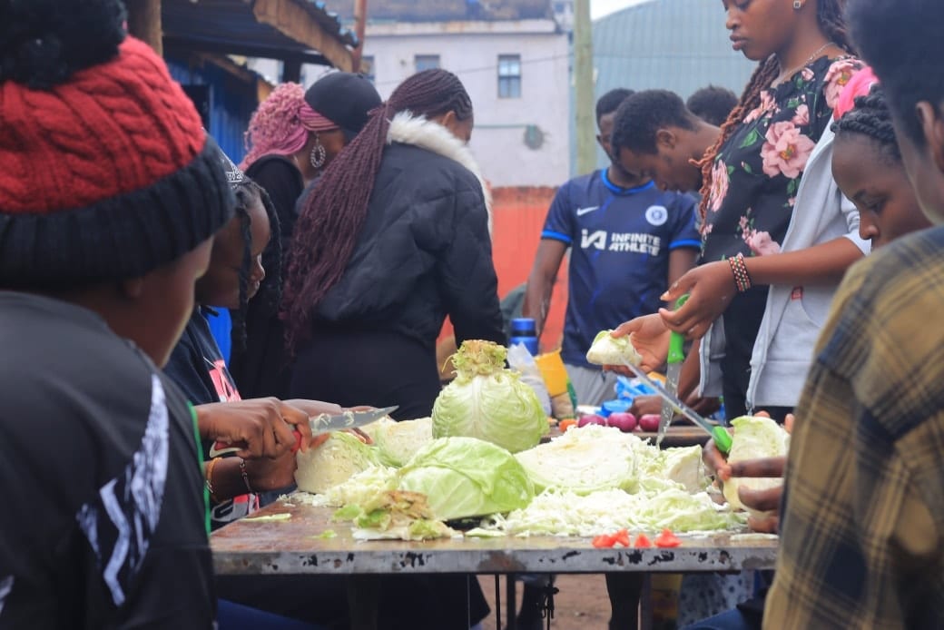 Volunteers preparing vegetables for a community meal