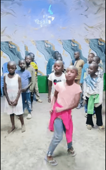 Children dancing and singing together indoors