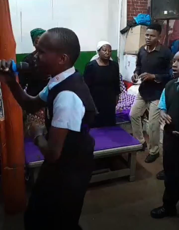 A child singing with heart indoors