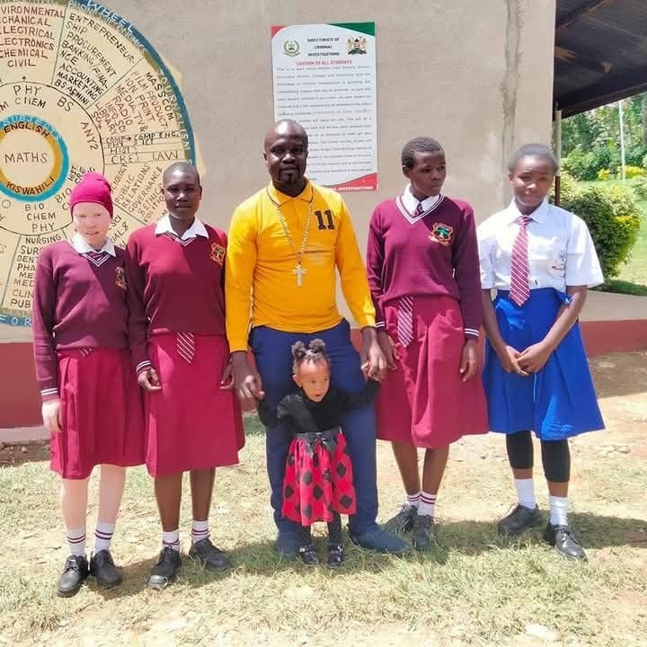 The founder with secondary-school students supported by the centre