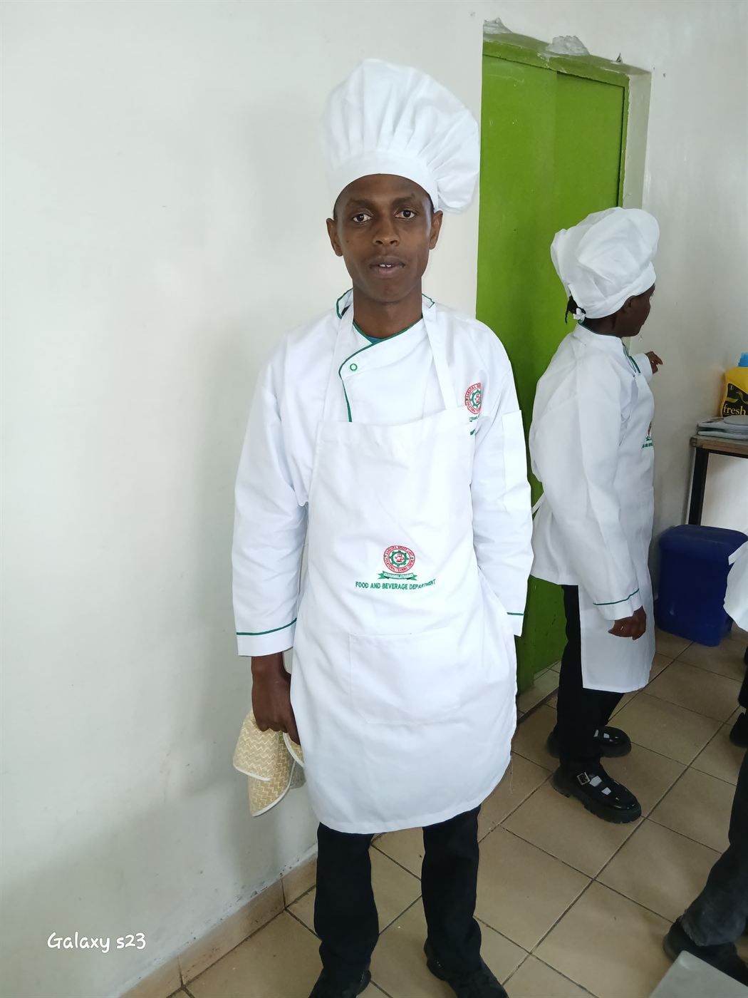 Wilson Irungu in his chef&rsquo;s uniform at catering school, an alumnus of The Grace Community Centre